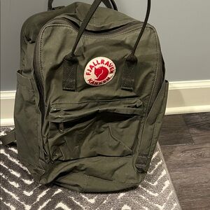 Fjallraven Kånken Backpack in Olive Green with Red Logo